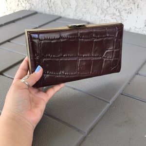 Brown faux snakeskin clutch